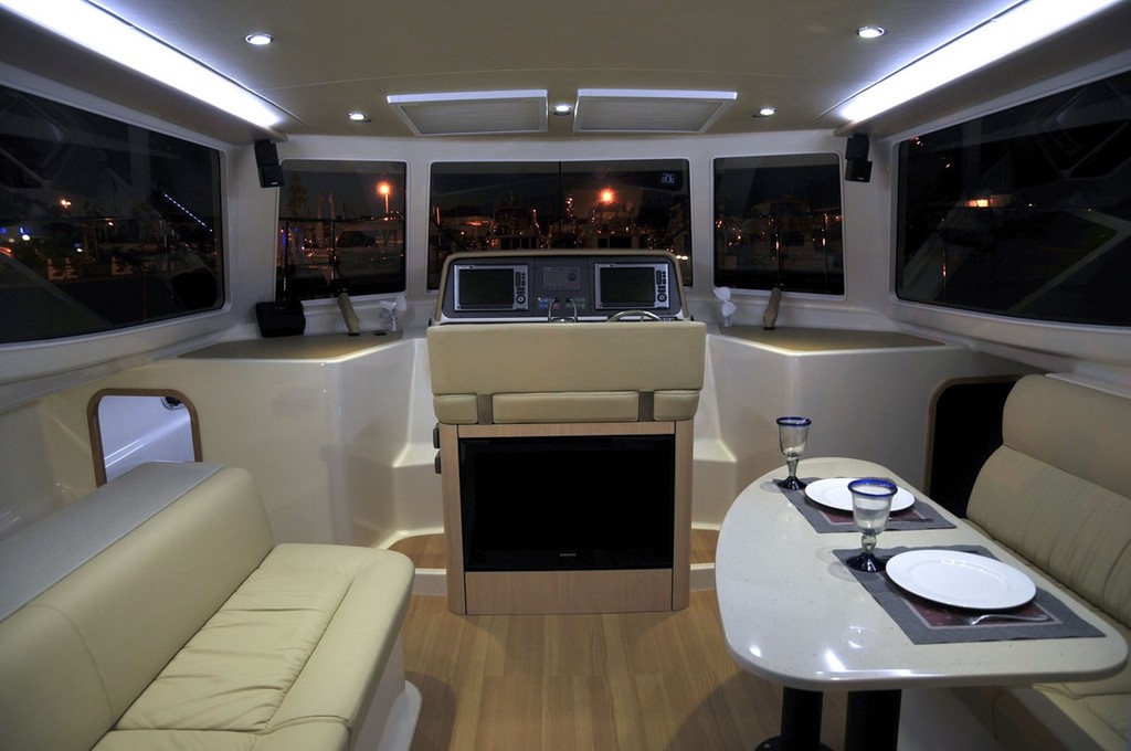 The saloon is tastefully appointed and has a high-tech helm © Outback Marine